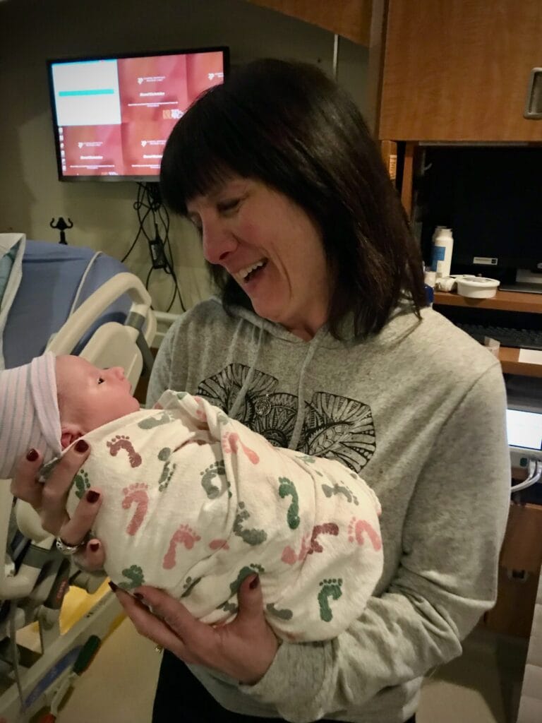 Lynsi Eastburn with a newborn baby