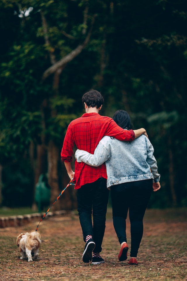 couple walking their dog